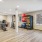 yoga room with wood floors and large windows 