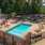 Resort-style swimming pool with lounge seating