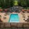 Resort-style swimming pool with lounge seating