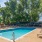 Resort-style swimming pool with lounge seating